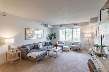 the living room of a two bedroom apartment at the enclave at woodbridge apartments in sugar land